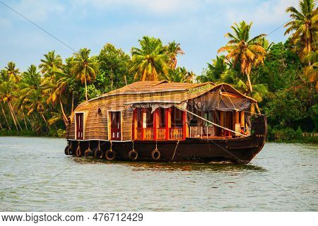 A Houseboat Sailing In Alappuzha Backwaters In Kerala State In India