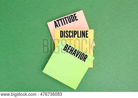 Colored Paper With The Words Attitude, Discipline And Behavior. The Concept Of Identity Or The Conce