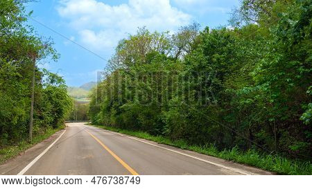 Road Goes Straight Ahead Of The Asphalt Road And The Curve At The End In Thailand. Two Besie With Gr