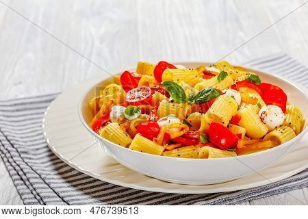 Roasted Pepper Tomato Mozzarella Pasta Salad In White Bowl On White Wood Table