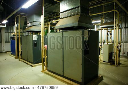 The Factory Walkway And Machine For Processing Metal Part Of Car. Warehouse And Store Keep Material 