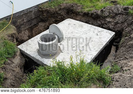 Concrete Septic Tank With A Capacity Of 10 Cubic Meters Placed In The Garden By The House, Visible W