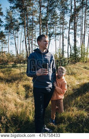 Happy Fathers Day. Dad And Son On A Walk In The Forest In Sunny Weather. Family Leisure. The Father 