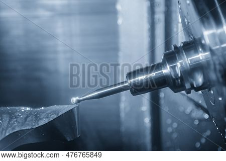 The 5-axis Machining Center Cutting The Automotive Parts By Ball End Mill Tool. The Hi-precision Aut