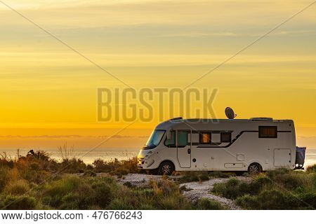 Caravan On Nature In The Morning At Sunrise