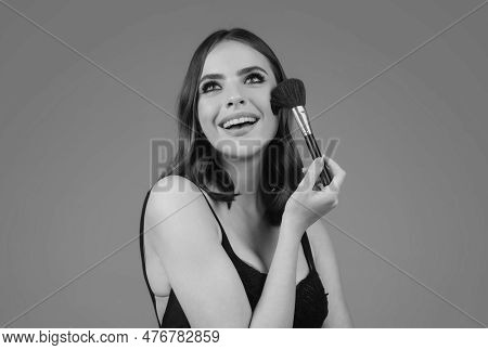 Closeup Portrait Of A Happy Smilin Model With Makeup Blusher Brush And Bright Makeup On A Face. Port