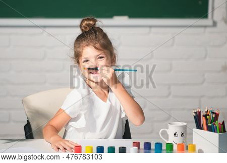Child Girl Drawing With Coloring Pens Paintind. Portrait Of Adorable Little Girl Smiling Happily Whi