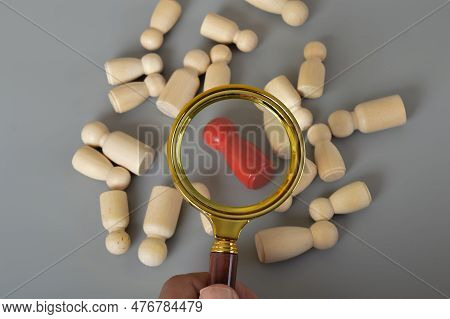 Magnifying Glass On The One Wooden Red Person. Embark On A Talent-hunting Adventure With The Concept