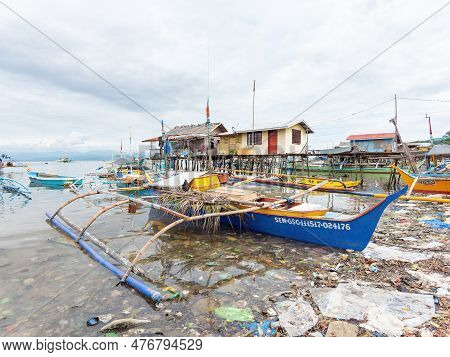 Sarangani, Philippines - January 17, 2018: A Traditional Outrigger Fishing Boat Floating In A Sea Of