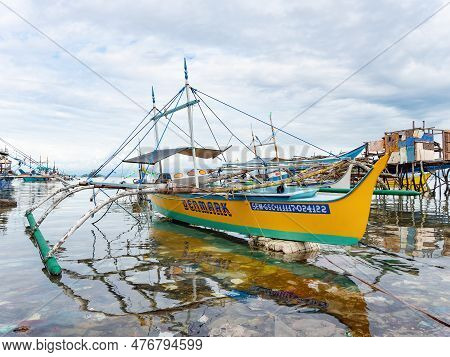 Sarangani, Philippines - January 17, 2018: A Traditional Outrigger Fishing Boat Named Denmark Floati