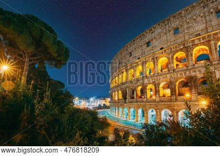 Rome, Italy. Amazing Bold Bright Dark Blue Night Starry Sky With Glowing Stars Above Colosseum Also 