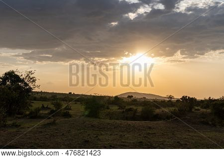 Iconic Dusk Orange Sunset Scene In The Masaai Mara Reserve In Kenya Africa