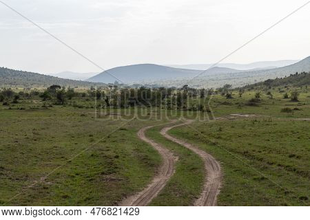 Dirt Track Roads For Safari Vehicles To Travel Through The Masaai Mara Reserve In Kenya, For Safari 