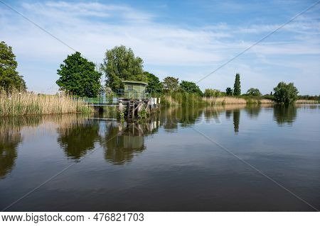 Scenic View Over Nature Reflections In The Water Of The River Durme, Tielrode, Flanders, Belgium