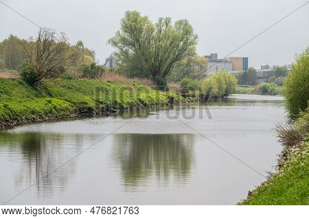 Nature At The Banks Of The River Dender With Industry In The Background, Dendermonde, East Flanders,