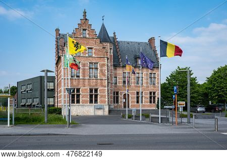 Sint-gillis-waas, East Flemish Region, Belgium - May 21, 2023 - Town Hall And Square With Local, Fle