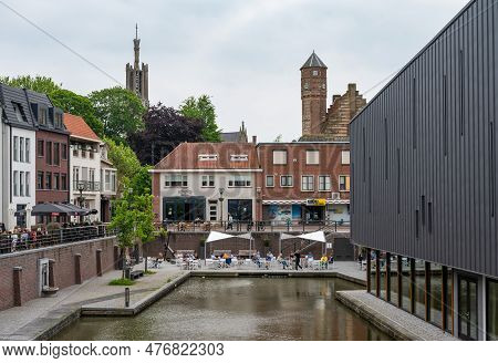 Hulst, Zeeland, The Netherlands - May 21, 2023 - Historical Buildings Reflecting In The Water Of The