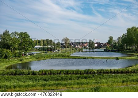 Baasrode, East Flemish Region, Belgium - May 18, 2023 - Ponds Of Wetlands At The Vlassenbroek Polder