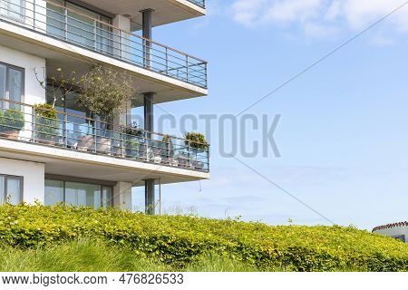 Large Balconies Against The Blue Sky. Real Estate Investment Concept.