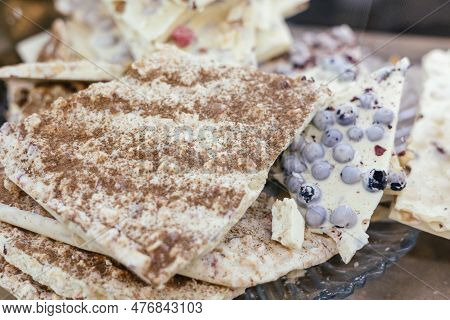 Handmade Chocolate With Additives On The Counter. Own Production. Sweets. Market.
