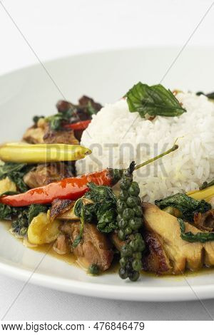 Pad Krapow Gai Spicy Thai Chicken Vegetable Stir Fry On White Plate