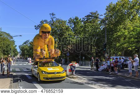 La Rochelle, France - September 08, 2020:the Traditional Yellow Cyclist Mascot During The Passing Of