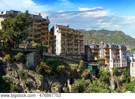 Picturesque Cityscape Of Andorra La Vella City. Residential Houses On The Rocks And Mountain Range A