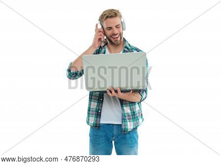 Positive Millennial Man Freelancer In Studio. Photo Of Millennial Man Freelancer With Laptop.