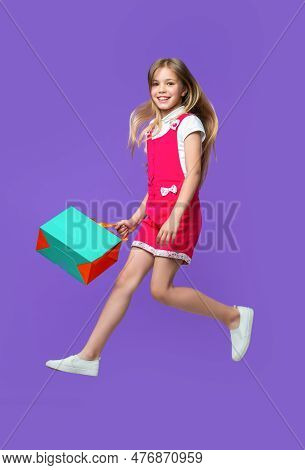 Happy Teen Girl Jumping After Shopping On Background. Photo Of Teen Girl Jumping