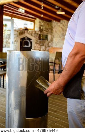 Pouring From High Height Of Natural Asturian Cider Made From fermented Apples In Cafe, Oviedo, Spain