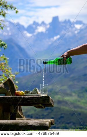 Pouring From High Height Of Natural Asturian Cider Made From fermented Apples, Asturian Cabrales Cow