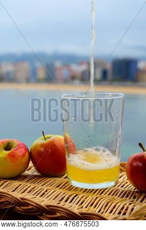Traditional Natural Asturian Cider Made From fermented Apples In Wooden Barrels Should Be Poured Fro