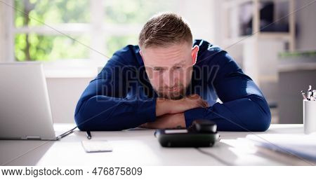 Man Waiting Phone Call At Office Desk