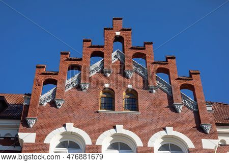 Topping The Gable Wall Of A Historic Building In The Neo-gothic Style.