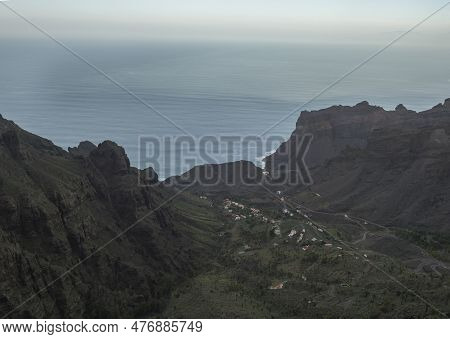 Aerial View Towards The Valley Of Village Taguluche With Small Houses, Sharp Cliffs And Atlantic Oce