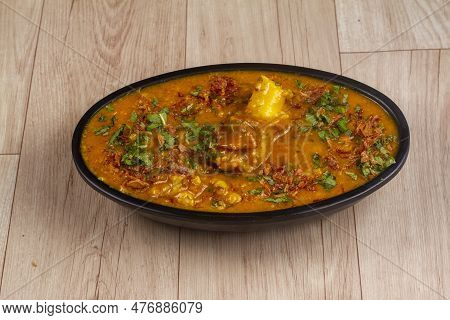 Mutton Khichda Or Haleem In Bowl On Wooden Background. Indian Food.