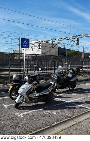 Gava - May 27, 2023: Motorcycle Parking Next To The Train Station