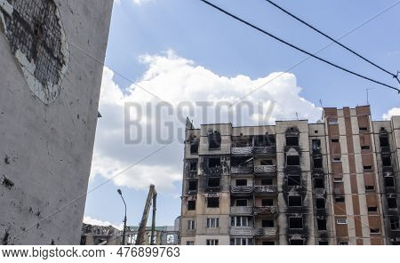 Traces Of An Artillery Shell Hitting A Multi-storey Residential Building. Shelling At Home. Conseque