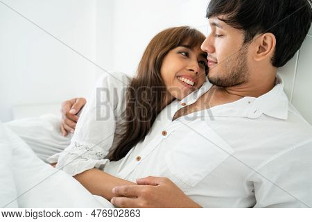 Happy Young Couple Relaxing At Home In The Morning.