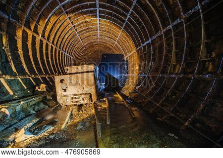 Old Abandoned Subway Tunnel With Rusty Trolley