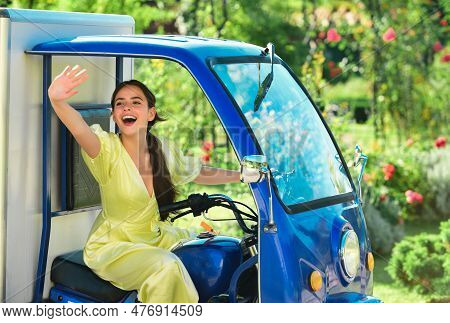 Smiling Amazed Young Woman Draver In Electro Car. Saving Ecology. Electric Cars.