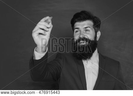 Portrait Of A Funny Teacher Or Professor Near Blackboard. Thinking Serious Mature Teacher. Mature Pr