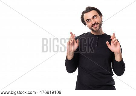 Hopeful 30s Authentic Brunet Male Adult In Black Sweatshirt Praying On White Background With Copy Sp