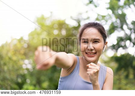 Fitness Asian Girl In Tight Sportswear Doing Exercises And Punching Boxing Footwork Cardio Exercise 