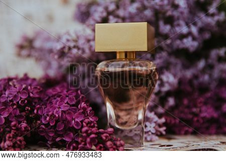 Perfume Among Lilac Flowers,  A Bottle Of Perfume Among The Flowers