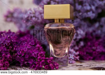 Perfume Among Lilac Flowers,  A Bottle Of Perfume Among The Flowers