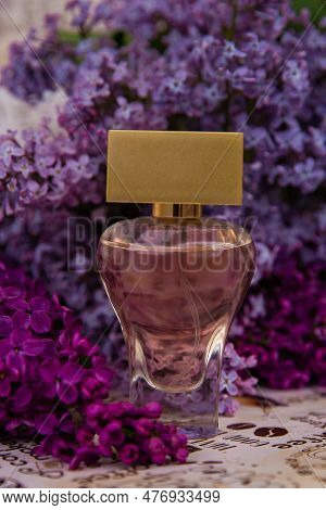 Perfume Among Lilac Flowers,  A Bottle Of Perfume Among The Flowers
