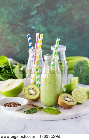 A Fresh And Healthy Green Smoothie In A Glass Bottle, Ready For Drinking.