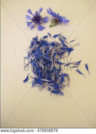 Herbal Blue Cornflower Flower Petals On A Wooden Board