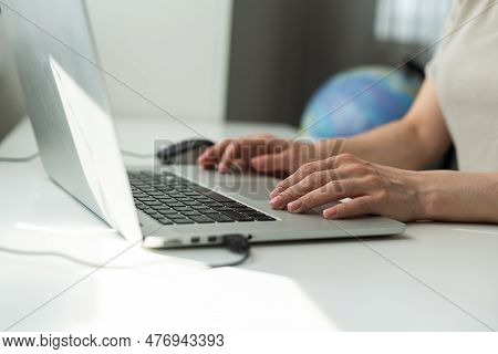 Successful Female Grapic Designer Watching Tutorial About Creative Ideas At Laptop Computer During W